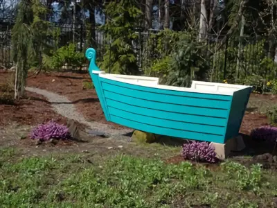 A sky blue boat-shaped pot for the garden